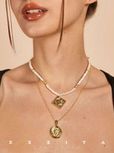 wearing the book of luck necklace and coin necklace